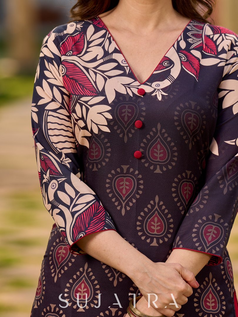 Statement black kurta with Kalamkari-inspired ombré prints and vibrant red touches.