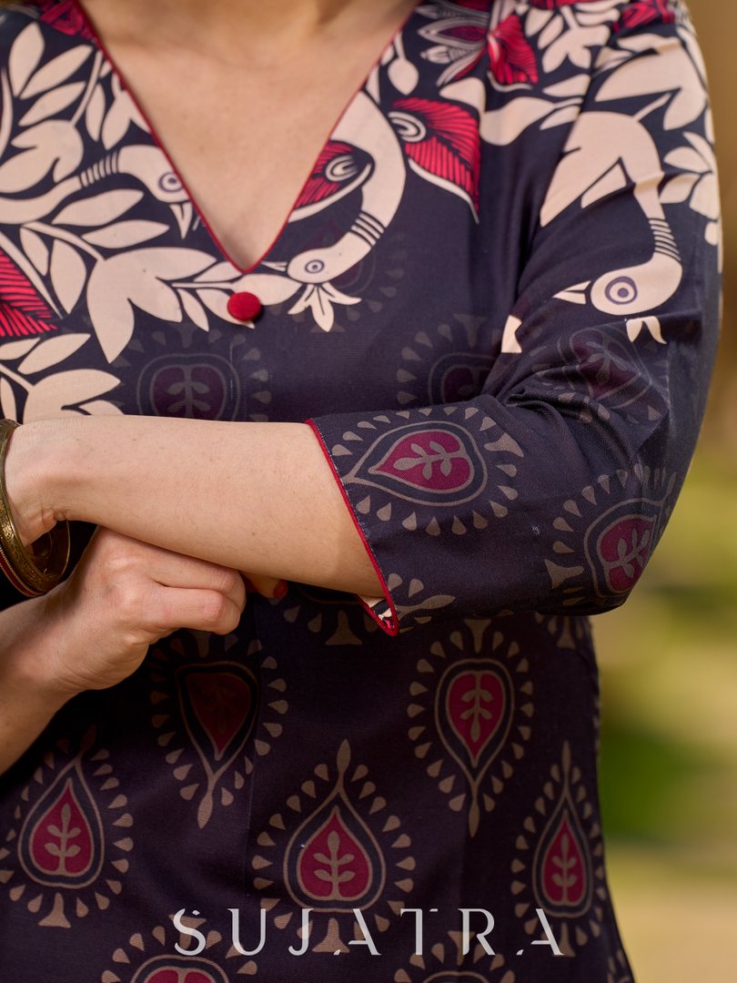 Statement black kurta with Kalamkari-inspired ombré prints and vibrant red touches.