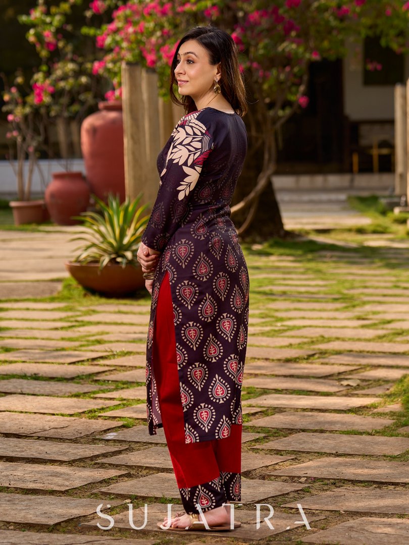 Statement black kurta with Kalamkari-inspired ombré prints and vibrant red touches.