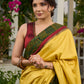 Vibrant yellow silk mix saree with hand block printed Ajrakh border