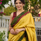 Vibrant yellow silk mix saree with hand block printed Ajrakh border