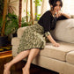 Olive floral dress featuring a contrasting black yoke, designed in a straight fit and highlighted with subtle floral accents for a clean, elegant earthy look