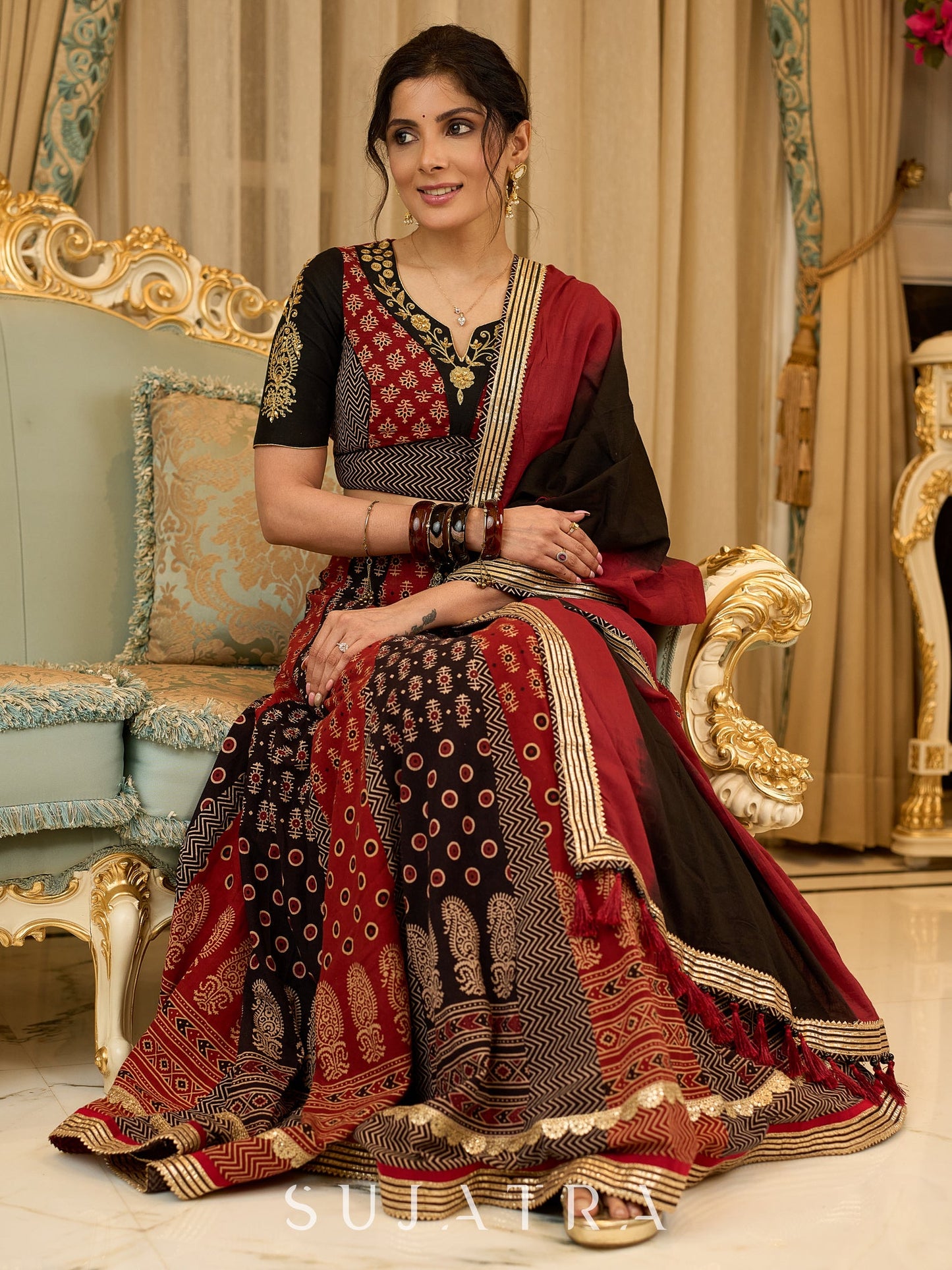 Handcrafted maroon & black Ajrakh print lehenga paired with an embroidered blouse for rich artisanal look - Dupatta Optional