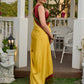 Vibrant yellow silk mix saree with hand block printed Ajrakh border