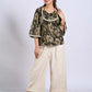 Chic Black Floral Print Cotton Bell Sleeve Top with Tie-Up Neckline & Crochet Lace Trim