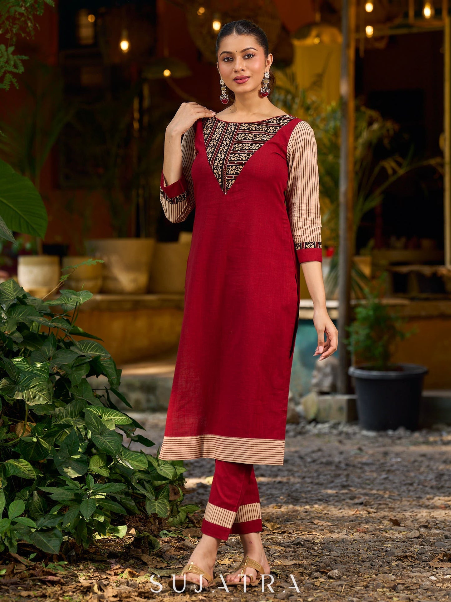 Handcrafted maroon kurta with a V-neck Ajrakh panel and stylish striped sleeves.
