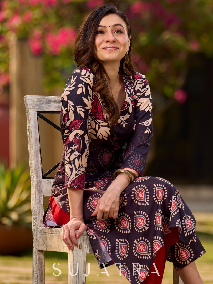 Statement black kurta with Kalamkari-inspired ombré prints and vibrant red touches.