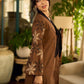 Brown block print dress with floral block printed flared sleeves, black tie-up neckline, and contrast black accents for an effortless, elegant everyday look.