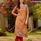 Elegant mustard kurta featuring Kalamkari print in an asymmetrical layout