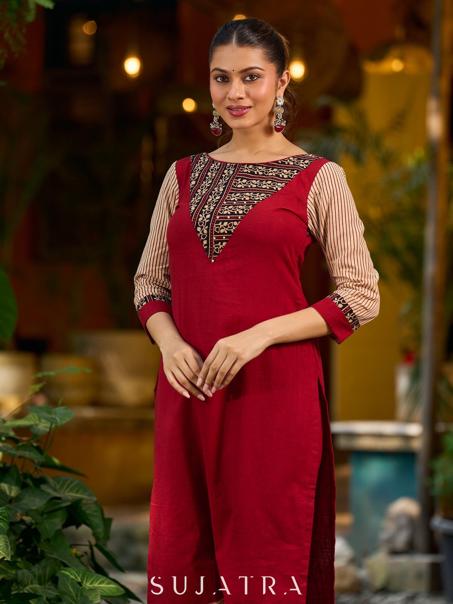 Handcrafted maroon kurta with a V-neck Ajrakh panel and stylish striped sleeves.