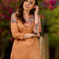 Elegant mustard kurta featuring Kalamkari print in an asymmetrical layout