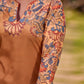 Elegant mustard kurta featuring Kalamkari print in an asymmetrical layout