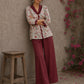 Soft white floral cotton top finished with maroon cuffs, pleated collar, and delicate feminine elegance.