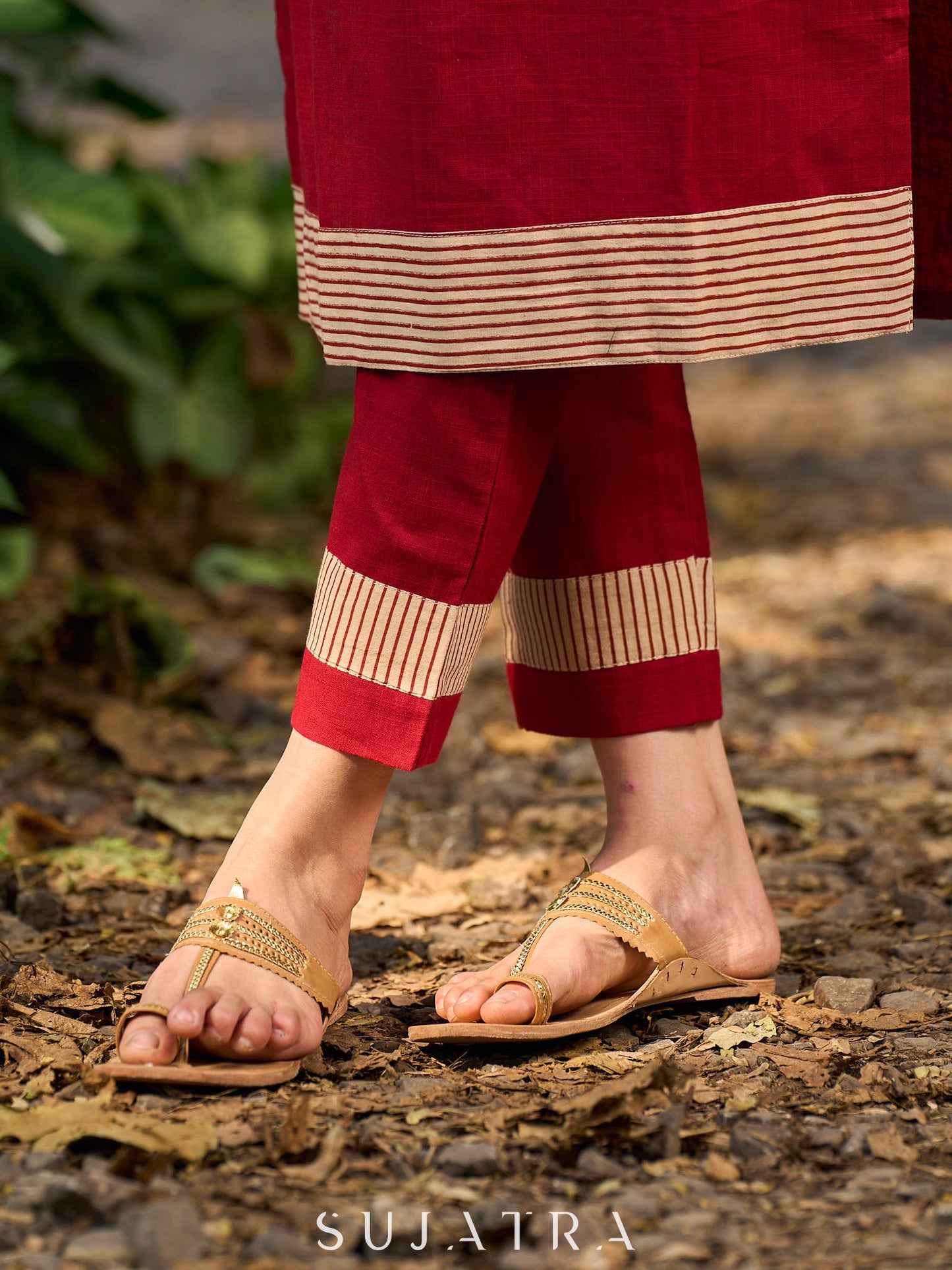 Handcrafted maroon kurta with a V-neck Ajrakh panel and stylish striped sleeves.