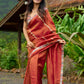 Luxury burnt orange tissue saree adorned with shimmering zari highlights