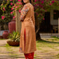 Elegant mustard kurta featuring Kalamkari print in an asymmetrical layout