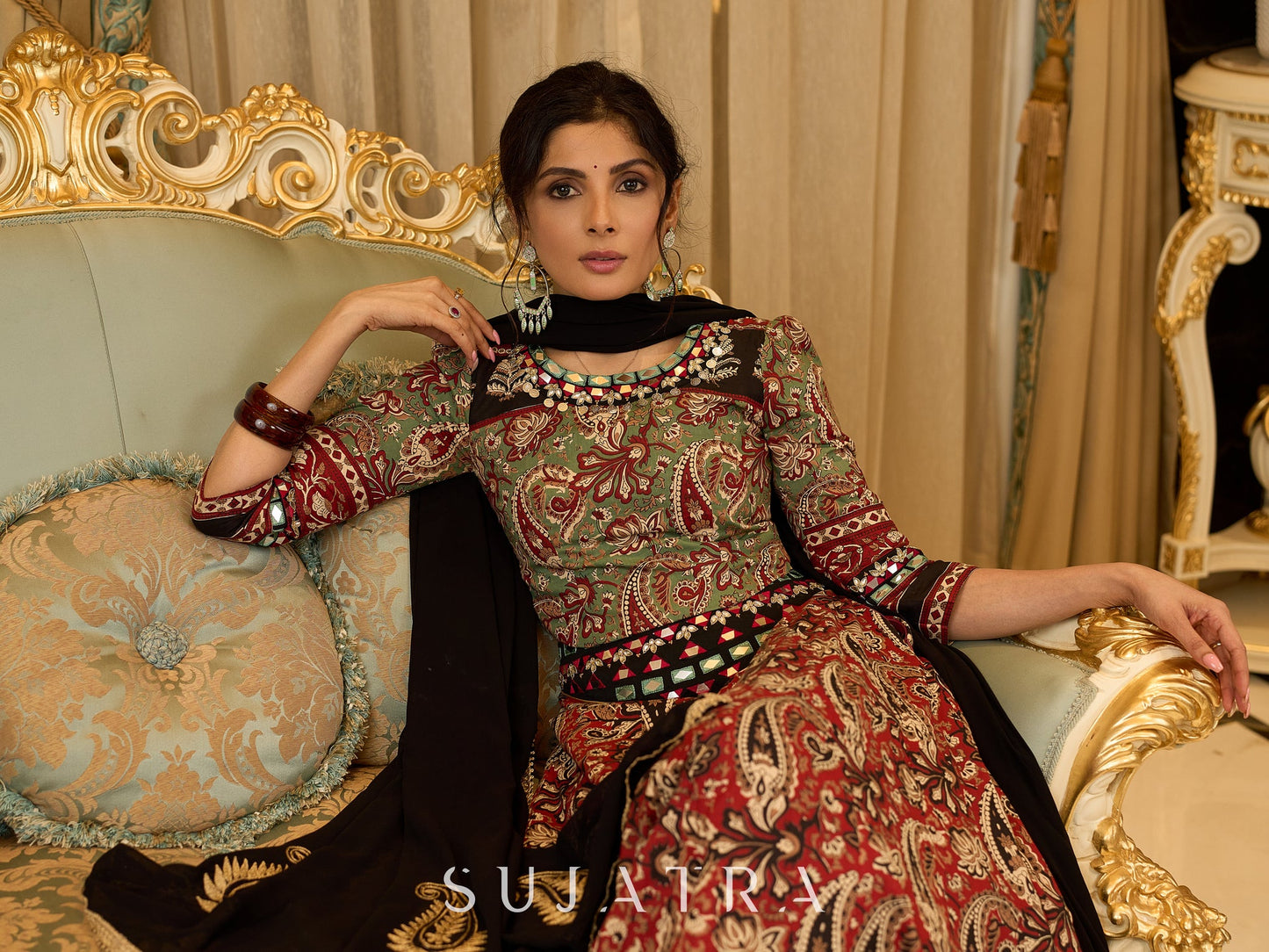 Contemporary folkloric ensemble featuring a petal cut block printed lehenga with mirror work accents  - Embroidered Dupatta Optional