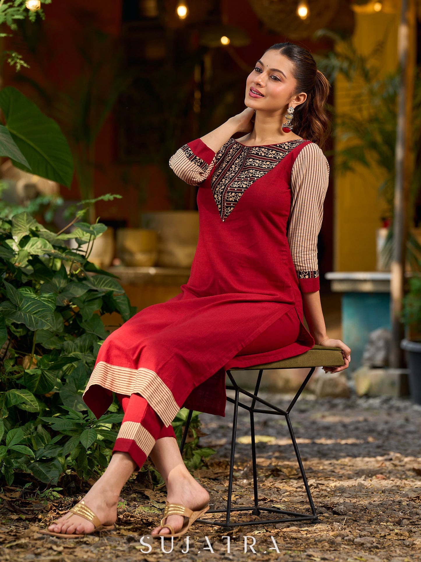 Handcrafted maroon kurta with a V-neck Ajrakh panel and stylish striped sleeves.