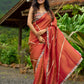 Luxury burnt orange tissue saree adorned with shimmering zari highlights