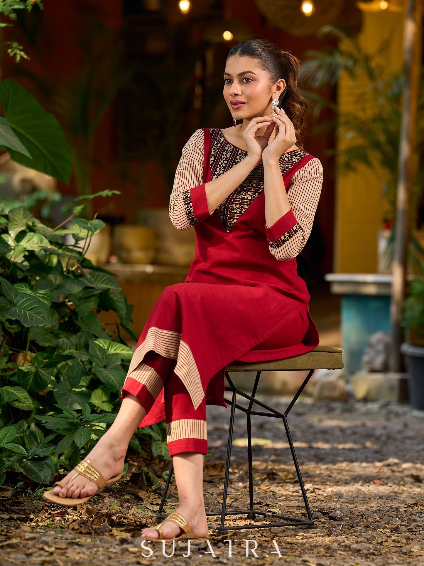 Handcrafted maroon kurta with a V-neck Ajrakh panel and stylish striped sleeves.