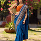 Elegant Blue Saree with Geometric Kalamkari Border and Contrasting Orange Accents