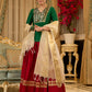 A traditional look featuring a red Cotton silk lehenga with a green Cotton silk choli with brocade yoke  - Contrast dupatta optional