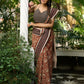 Earthy block-printed cotton saree with paisley charm and rustic elegance