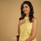Stylish halter neck top crafted in soft yellow hakoba .