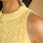 Stylish halter neck top crafted in soft yellow hakoba .