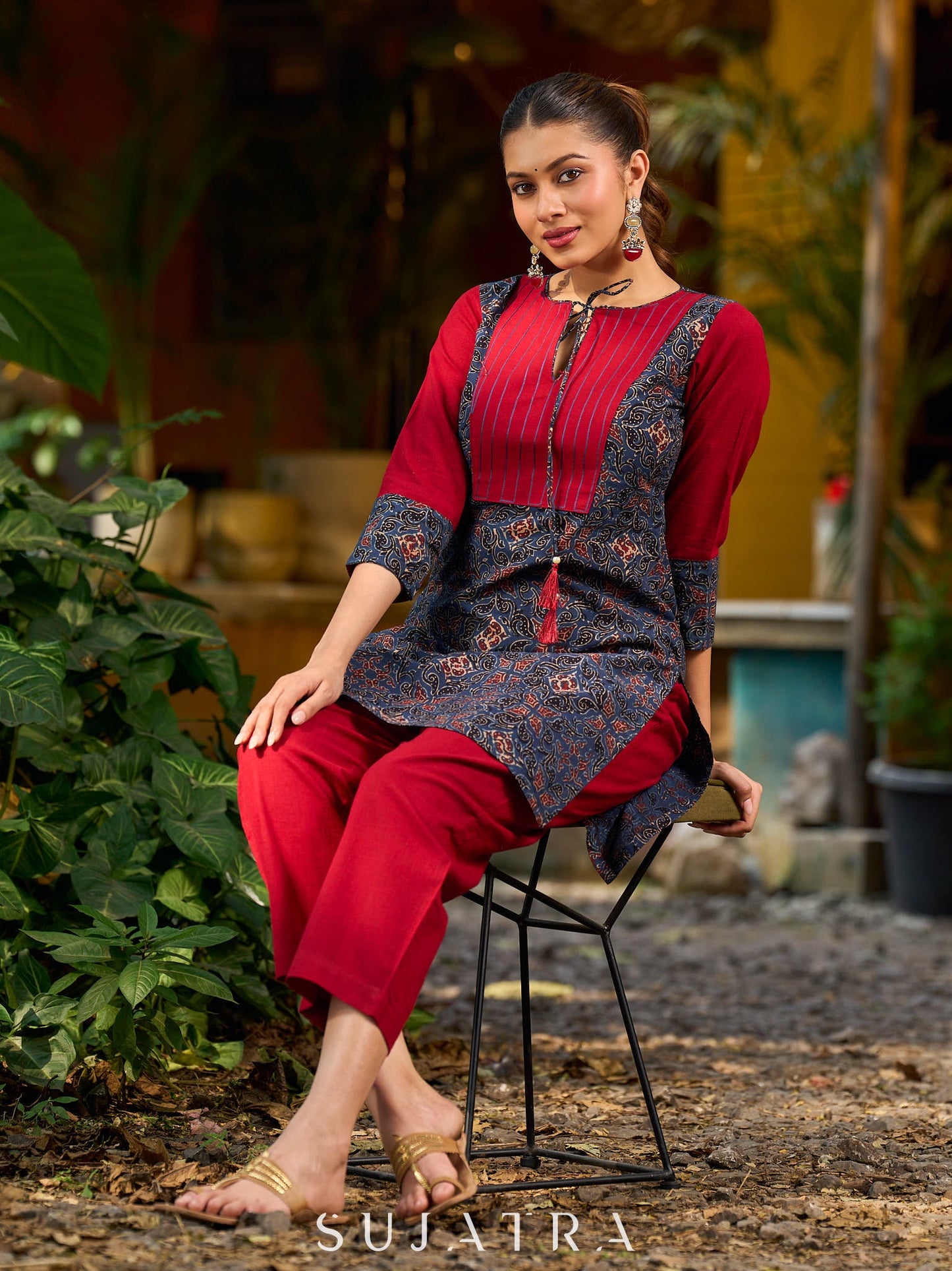 Blue Ajrakh short kurta with a handcrafted maroon patch.