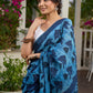 Hand block printed cotton saree in blue symphony and striking motifs