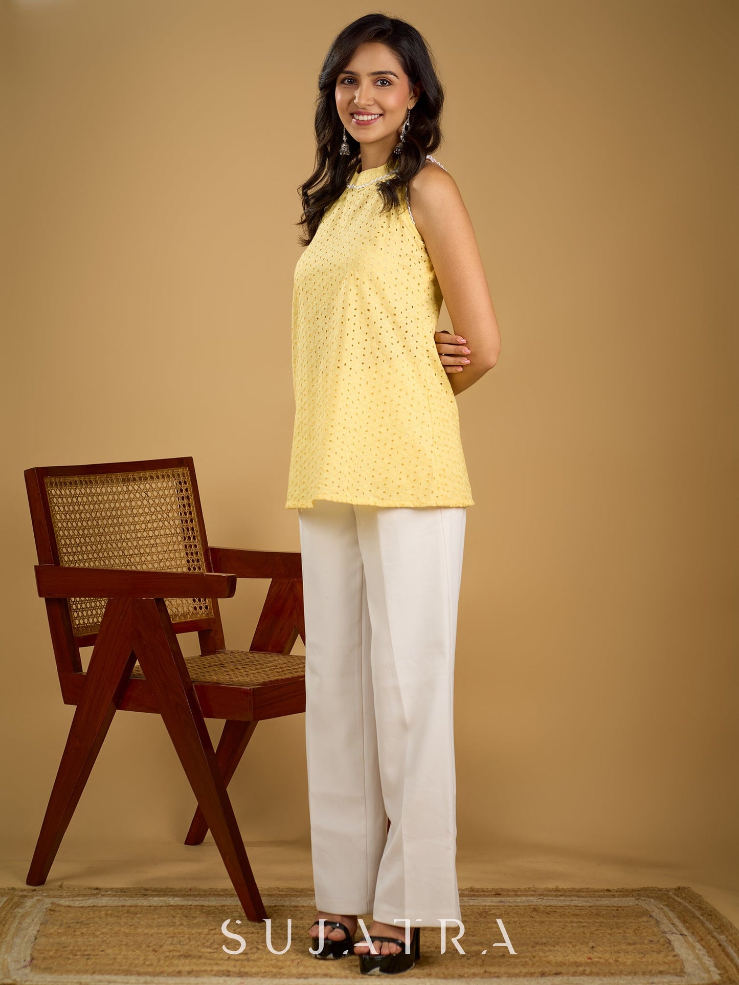 Stylish halter neck top crafted in soft yellow hakoba .