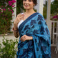 Hand block printed cotton saree in blue symphony and striking motifs