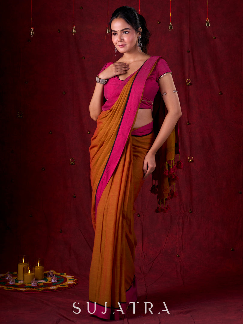 Autumn Rust Mul Cotton Saree with Pink Striped Border, Delicate Black Detailing & Tassel Highlights