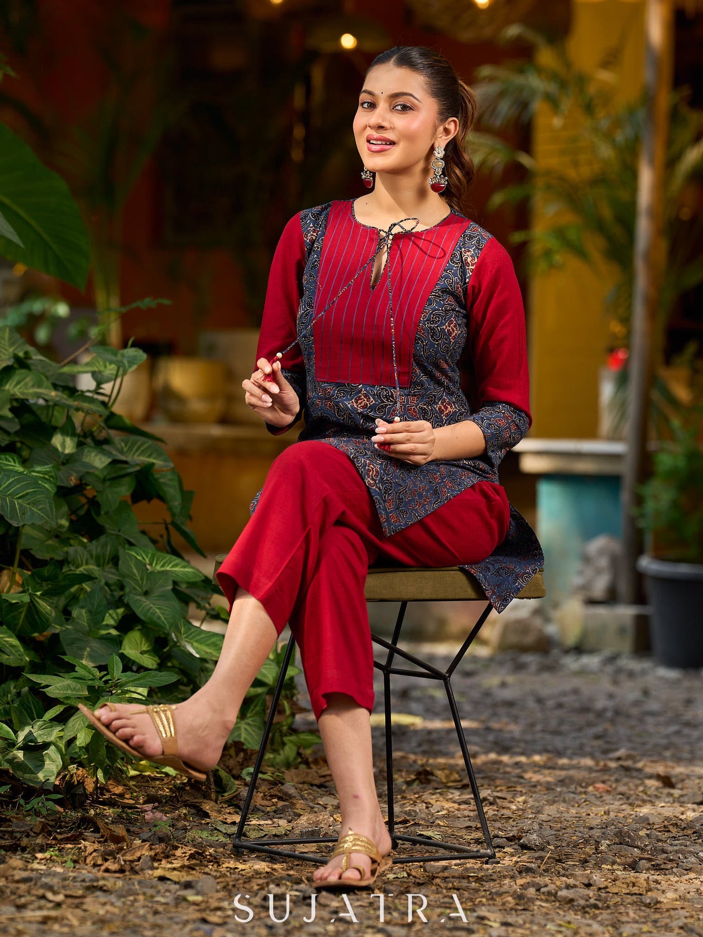 Blue Ajrakh short kurta with a handcrafted maroon patch.