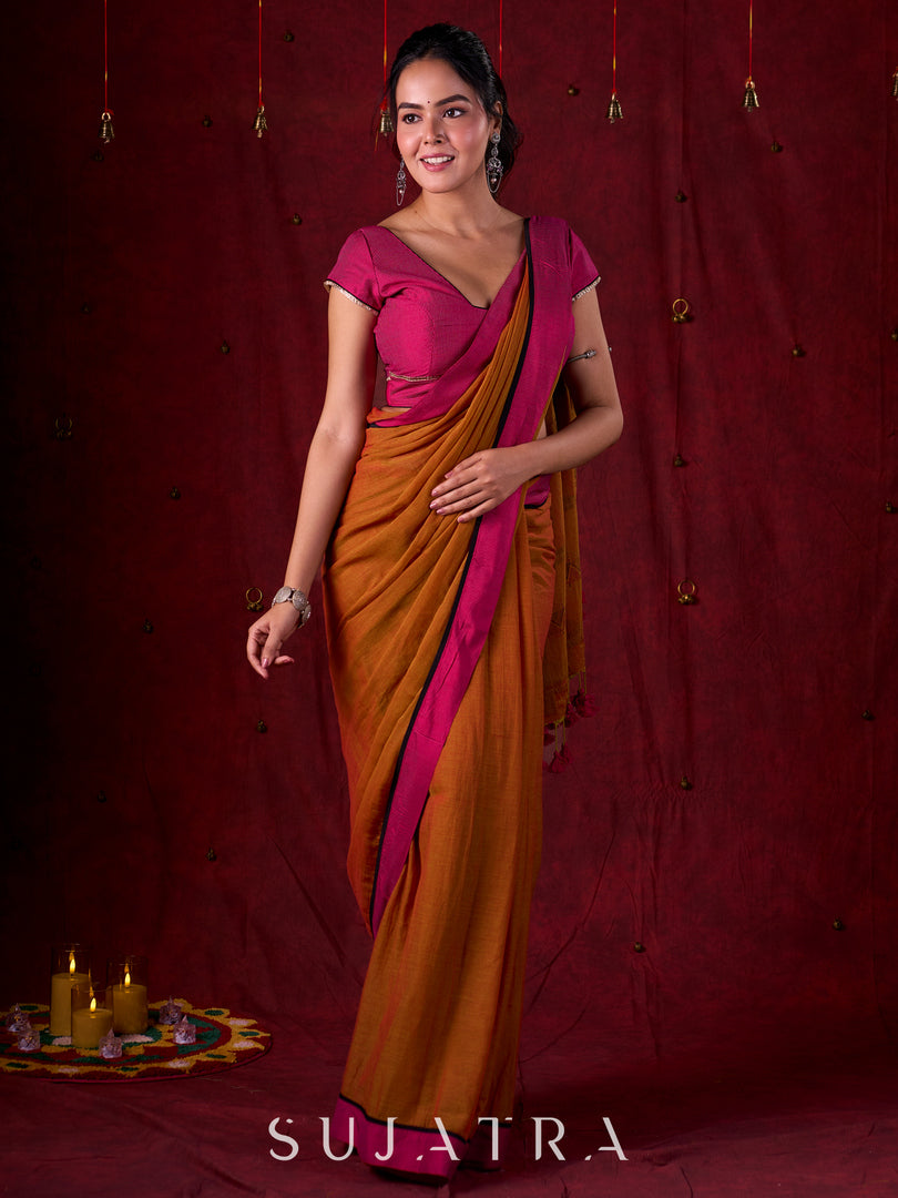 Autumn Rust Mul Cotton Saree with Pink Striped Border, Delicate Black Detailing & Tassel Highlights