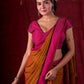 Autumn Rust Mul Cotton Saree with Pink Striped Border, Delicate Black Detailing & Tassel Highlights