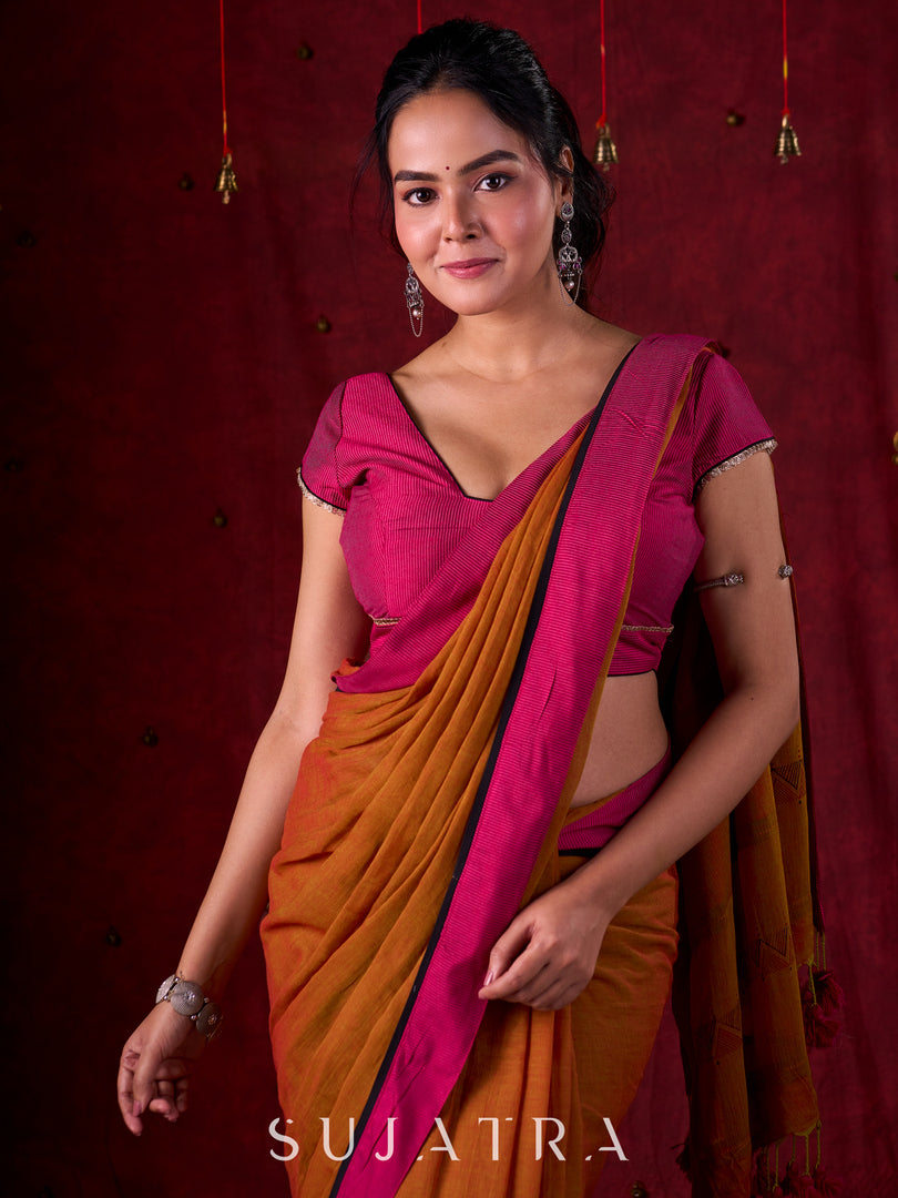 Autumn Rust Mul Cotton Saree with Pink Striped Border, Delicate Black Detailing & Tassel Highlights