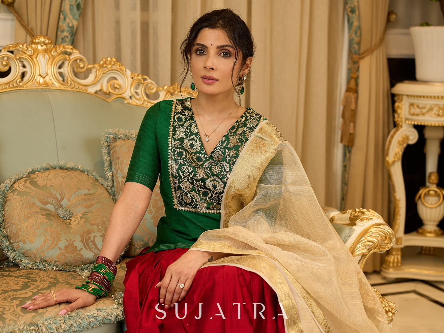 A traditional look featuring a red Cotton silk lehenga with a green Cotton silk choli with brocade yoke  - Contrast dupatta optional