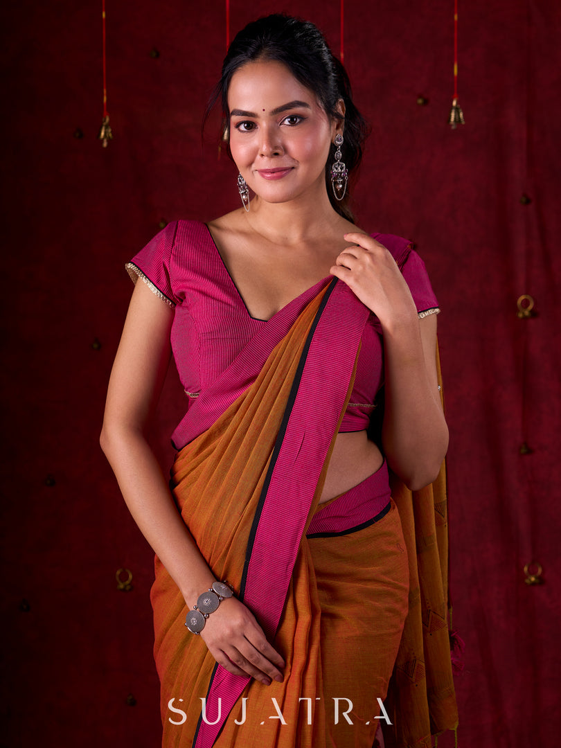 Autumn Rust Mul Cotton Saree with Pink Striped Border, Delicate Black Detailing & Tassel Highlights
