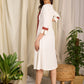 Elegant white cotton dress with bold block print and intricate detailing