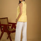 Stylish halter neck top crafted in soft yellow hakoba .