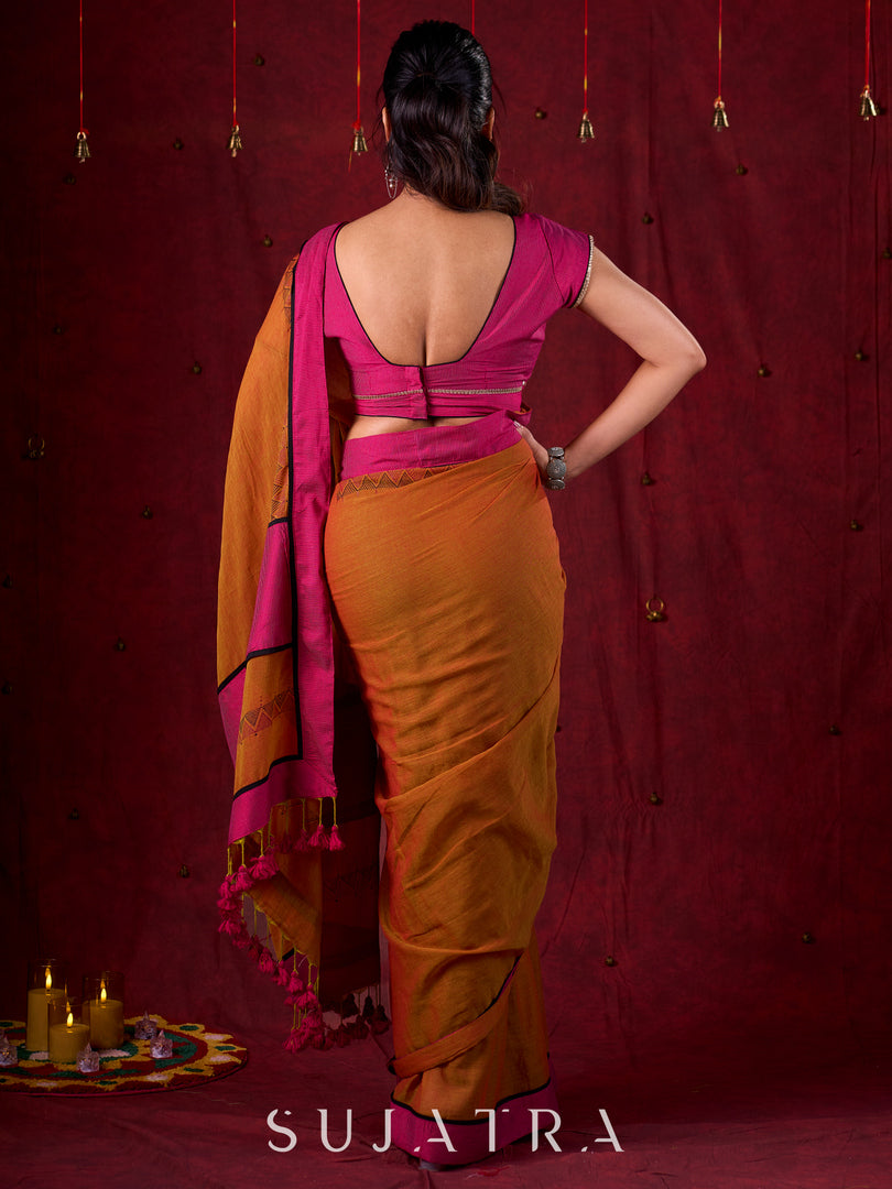 Autumn Rust Mul Cotton Saree with Pink Striped Border, Delicate Black Detailing & Tassel Highlights