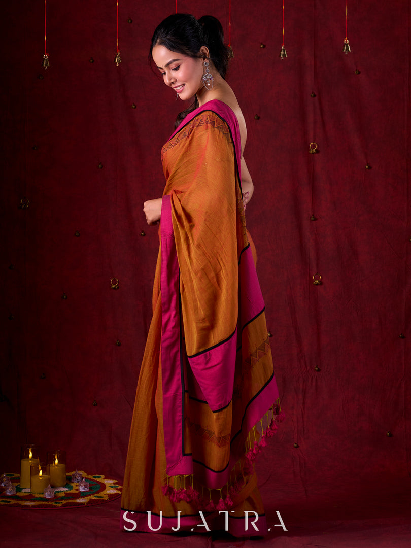 Autumn Rust Mul Cotton Saree with Pink Striped Border, Delicate Black Detailing & Tassel Highlights