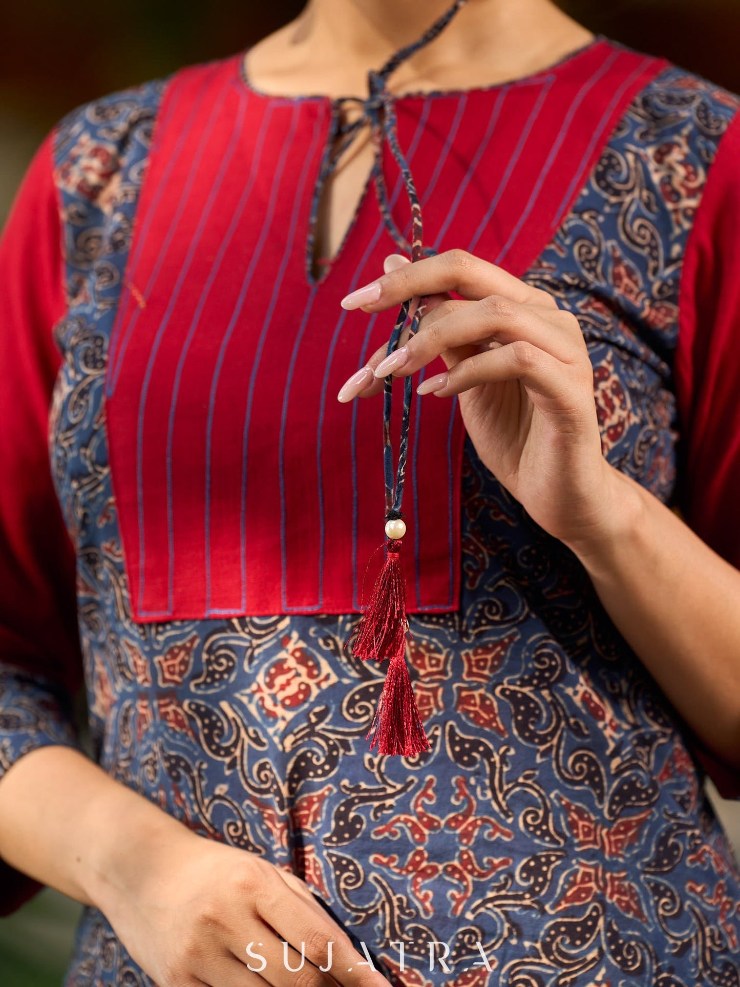 Blue Ajrakh short kurta with a handcrafted maroon patch.