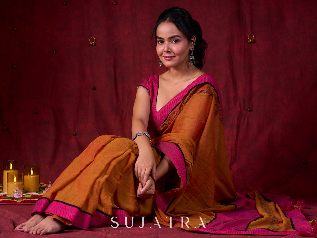 Autumn Rust Mul Cotton Saree with Pink Striped Border, Delicate Black Detailing & Tassel Highlights