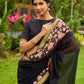 Vibrant Black Georgette Saree with Golden Zari Border & Kalamkari Floral Print Pallu & Border