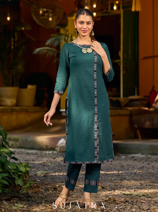 bottle green solid kurta with a refined ajrakh edging.