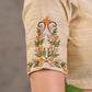 Blouse en coton et soie crème avec broderie florale faite main sur l'ensemble et les manches