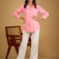 Delicate hand painting enhances this baby pink collared cotton top